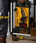 Person carrying Compact Portable Jobsite Table Saw with Fifteen Amp Motor and Eight and a Quarter Inch Cut Capacity