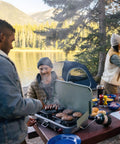 Three In One Outdoor Camp Stove With Removable Cast Iron Grill And Griddle 24,000 BTUs Portable Tailgate Ready Cooker at campsite