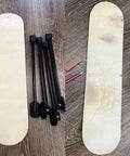 Sweet Set Of Four Portable Folding Table Legs Crafted From Skateboards And Longboards With Protective Floor Pads laid next to deck.