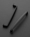 Top view of 30 Pack Solid 5 Inch Cabinet Handles Matte Black Pulls For Kitchen Drawers And Cabinets on a dark surface