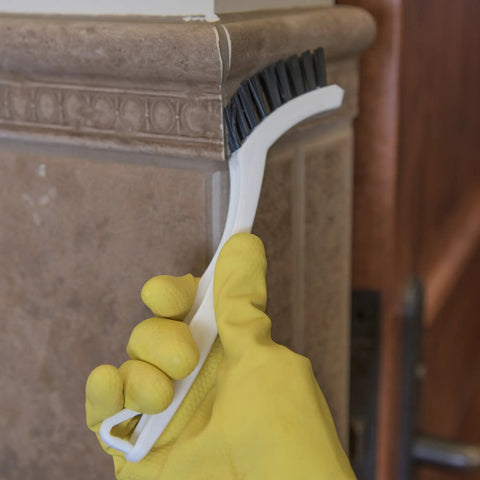 Flo Pac Grout Brush with nylon bristles used for scrubbing tight grout lines and seams on tile with 8 inch angled handle