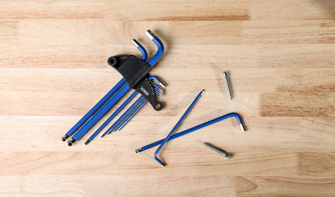 Metric Long Arm Ball End Hex Key Set With Chrome Finish And Bright Blue Anti-Slip Coating Includes 9 Sizes From 1.5mm To 10mm on wood