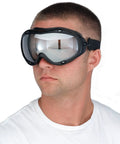 Person wearing Ranger Safety Goggles With Vented Frame That Fit Over Most Prescription Glasses, Clear Lenses, Adjustable Strap