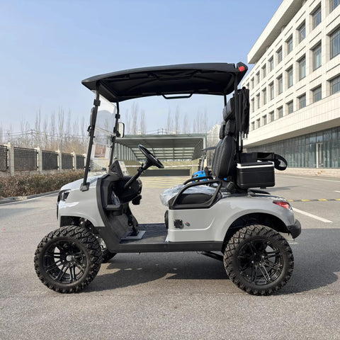 Two Seater Electric Golf Cart With Independent MacPherson Strut Suspension And Tuned Coil Spring Shocks side view with gray shell and black wheels.
