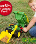 Child playing with Motorized Dig Rig 2 In 1 Toy Dump Truck And Front Loader with realistic lights and sounds in backyard.