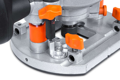 Close-up of base of Rock-Solid 15 Amp Variable Speed Plunge Router Kit with edge guide and adjustment knobs visible.