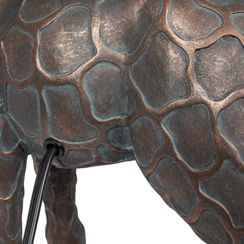 Close-up of resin giraffe table lamp with bronze finish and cord switch. Resin Giraffe Table Lamp With Linen Shade And Bronze Finish Whimsical Animal Accent Light For Living Room Or Desk 13.75 Inch Tall Cord Switch Distressed Look Maximum 40W Bulb.