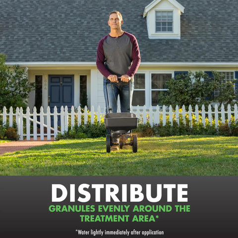 Man spreading Triazicide Insect Killer For Lawns Granules Kills Lawn Insects Above And Below Ground Including Ants in yard.