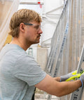 Man wearing Kickass Rimless Wraparound Safety Glasses With Ultra Light Twenty One Gram Flex on a construction site.