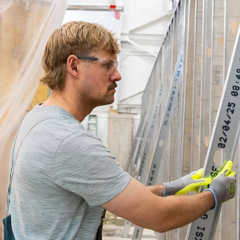 Man wearing Kickass Rimless Wraparound Safety Glasses With Ultra Light Twenty One Gram Flex on a construction site.
