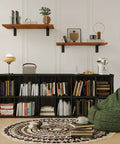 Modern living room with two wooden shelves mounted using Beefy Heavy Duty L Shelf Brackets 6 Pack Matte Black 20 By 5.6 Inch Floating Shelf Brackets Support Up To 300 Lbs Per Pair Wall Mount Hardware Included For Home Garage.