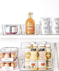 Clear Fridge Egg Container, 21 Egg Capacity, No Fuss Sturdy Plastic Egg Tray With Lid holding eggs on fridge shelf
