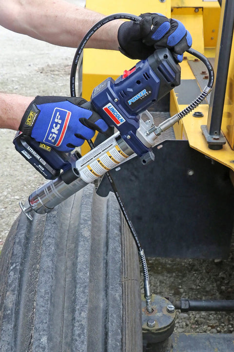 PowerLuber 20V Cordless Grease Gun With 36 Inch Hose High Output 10000 PSI in use on industrial equipment