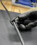Gloved hand using Hard Cable Jacket Strippers For Pros Portable Electrician Tool for precise jacket removal on cable