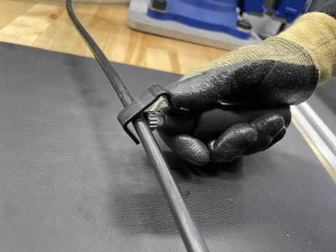Gloved hand using Hard Cable Jacket Strippers For Pros Portable Electrician Tool for precise jacket removal on cable