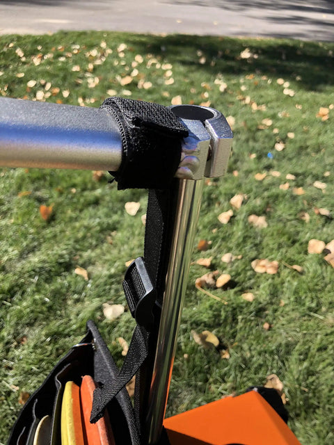 Power Pocket Disc Golf Cart Putter Pouch For Discs And Accessories That Lets You Grab Up To Eight Discs On The Fly Plus Easy Access To Your Rangefinder Phone And Keys While You Roll To The Next Hole attached to cart.