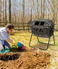 Person gardening next to Dual Chamber Outdoor Compost Tumbler With 43 Gallons Capacity 360 Degree Rotating Barrel for composting.