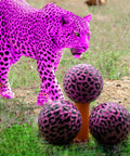 Pink Leopard Print Novelty Golf Balls 12 Pack With Bold 360 Degree Leopard Design Perfect Gift For Golfers shown with pink leopard background