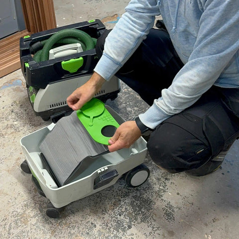 Person inserting Reusable Dust Bag For Festool Midi CT 15 E And CT 25 HEPA Dust Extractors into vacuum cleaner