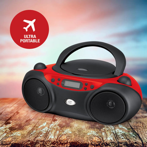 Portable Top-Loading CD Boombox With AM/FM Radio And 3.5mm Line In, red and black design, on wooden surface, outdoor backdrop
