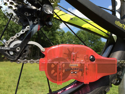 Chain Cleaning Tool II For Bike Chains Red Heavy Duty Plastic Chain Pig II With Bristle System Built To Last Chemical Resistant Design For Adults Long Lasting Performance Model PED218 on bike chain