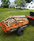 Tow Behind Dump Cart For Lawn And Garden 1500 Pound Capacity 15 Cubic Feet Heavy Duty Yard Garden Trailer attached to mower hauling logs