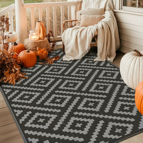 Durable 5x8 Outdoor Rug For Patio And RV Use, Waterproof Reversible Plastic Mat with pumpkins on a porch