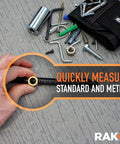 Hand using 11 In 1 Multitool Pen Set With LED Light And Stylus Screwdrivers Level Ruler Bottle Opener And More Cool Gadgets 2 Pack EDC Tactical Pens Gift For Men Dad Handy Guys Gift Box Ready to measure with standard and metric tools, scattered screws and bolts nearby.