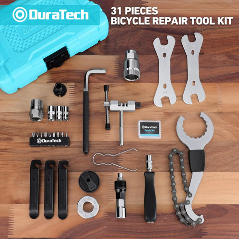 All In One 31 Piece Bicycle Repair Kit With Storage Box For Mountain Road And Park Bikes, tools displayed on wooden surface