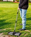 Man using Four Roller Aluminum Lawn Leveling Rake With 61 Inch Adjustable Handle For Smooth Soil In Lawns Gardens.