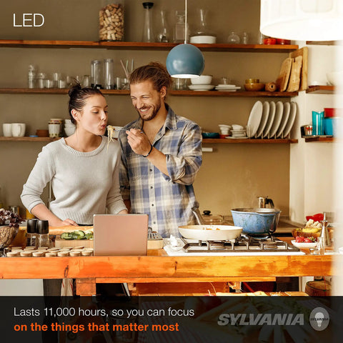 Couple cooking in kitchen with LED A19 Light Bulb 60W Equivalent 9W Energy Efficient 800 Lumens Soft White illuminated space.