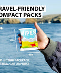Person holding Biodegradable Body Wipes With Tea Tree Oil And Aloe Vera On The Go Fresh Wipes For Camping Hiking Post Workout