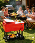 80QT Rolling Cooler On Wheels With Bottle Opener Outdoor Beverage Cooler For Patio And Backyard BBQ Beach Trip Or Party Holds Up To 100 Cans Keeps Drinks Cold 48 Hours And Warm 8 Hours Easy Access Storage Tray in use during a barbecue