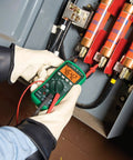 Electrician using Pro Grade Digital Multimeter DM200A 1000 Volt For Field Work Auto Range True RMS Durable Construction Easy Read LCD