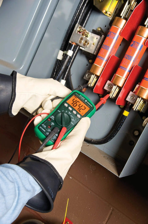 Electrician using Pro Grade Digital Multimeter DM200A 1000 Volt For Field Work Auto Range True RMS Durable Construction Easy Read LCD