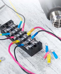 All In One Heat Shrink Wire Connectors Kit For Marine And Auto Use with connectors and tubing on a wooden surface