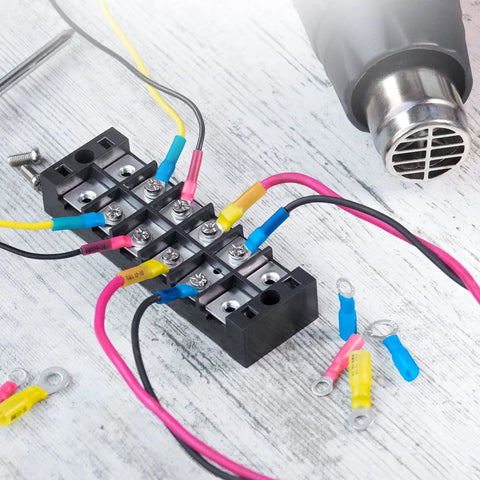 Marine Grade Heat Shrink Ring Terminals For 16 To 14 AWG Red Eyelet Connectors Waterproof Electrical Terminal Pack Of 130 Easy Crimp And Seal Ideal For Boat And Auto Wiring shown in use with wiring harness and heat gun.