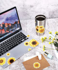 Laptop and mug with sunflower decals from 72 Pieces Sunflower Wall Sticker Set Peel And Stick 3D Removable Waterproof Decals For Bedroom Kitchen Bathroom Living Room Bright Sunny Wall Decor For Kids And Home