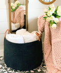 Black Cotton Rope Storage Basket With Real Leather Handles Big 20x13 Inch Blanket And Toy Organizer in a cozy room scene