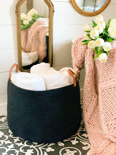 Black Cotton Rope Storage Basket With Real Leather Handles Big 20x13 Inch Blanket And Toy Organizer in a cozy room scene