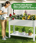 Woman watering plants in Elevated Garden Bed On Four Legs With Four Lockable Wheels And Storage Shelf For Balcony Patio Backyard