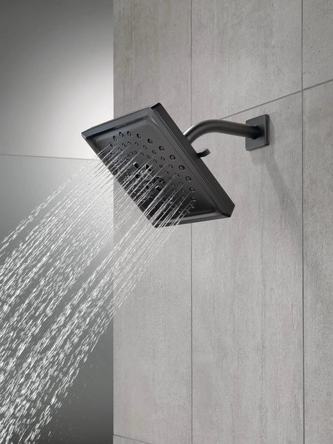 Side view of Three-Spray H2Okinetic Shower Head Matte Black 52684-BL in use, demonstrating water flow with PowerDrench spray.