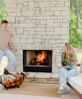 Curved 24.5 Inch Firewood Rack With Kindling Hooks for Indoor Use, by outdoor fireplace, logs neatly stacked on rack.