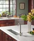 Contempo Trough Stainless Steel Kitchen Bar Sink Undermount 23 Inch With Strainer And Grid in modern kitchen setting.