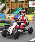 Child riding 12V Electric Go Kart For Kids With Forward And Backward Drive, Adjustable Speed, Smooth All Terrain EVA Wheels, White