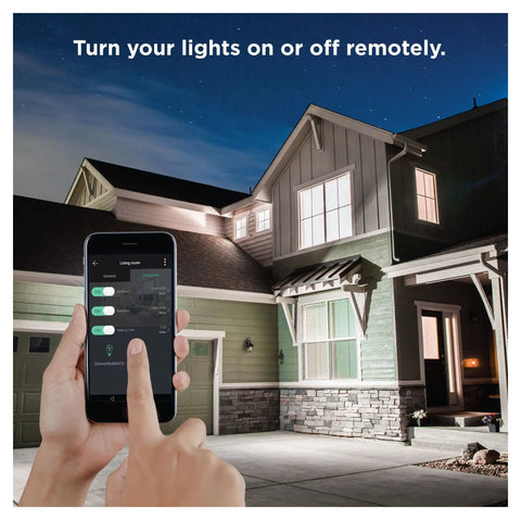 Person controlling BR30 Dimmable Smart Flood Light Bulb, 650 Lumens, 9W, Soft White 2700K via smartphone in front of house