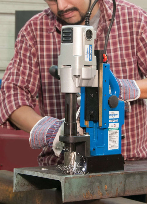 Hougen HMD904 115-Volt magnetic drill; blue and gray metal tool drilling steel.