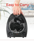 Compact Personal Desk Space Heater For Office And Home Three Settings with Built In Fan held by a hand showcasing portability