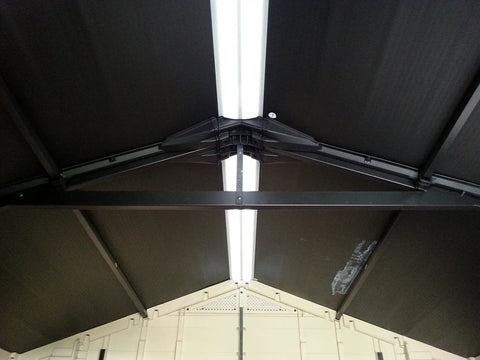 Interior roof view of Factor 6x3 Outdoor Storage Shed Kit showing resin construction and steel reinforcement in taupe and brown.