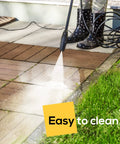 Person cleaning interlocking 12 by 12 inch balcony patio deck tiles 12 pack waterproof weatherproof floor tiles in outdoor setting.